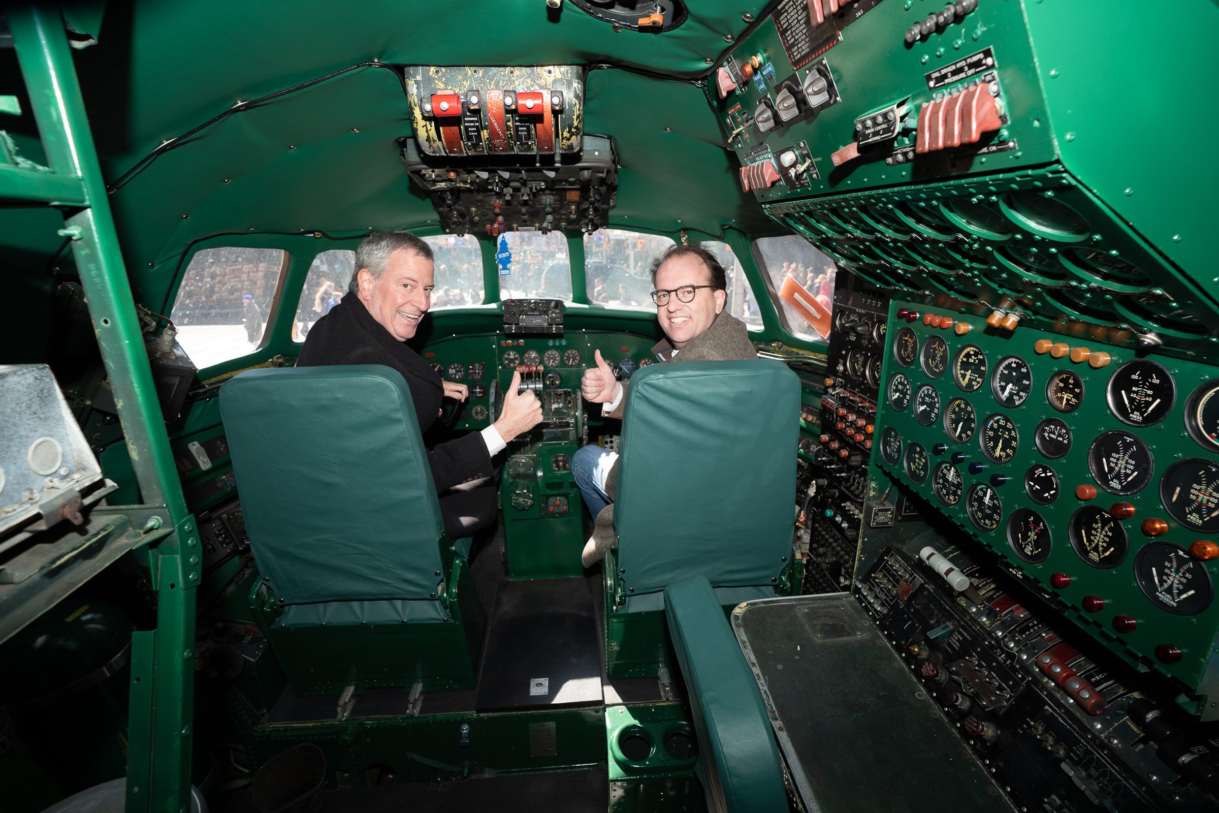New York City Mayor Bill de Blasio (left) takes the controls in Connie’s cockpit with CEO and Managing Partner of MCR and MORSE Development Tyler Morse on March 23, 2019.